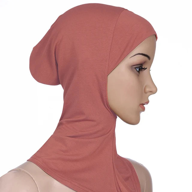 Breathable athletic underscarf hijab for women in a Red by AmoorFemme. Made from sweat-wicking material for comfort during workouts.