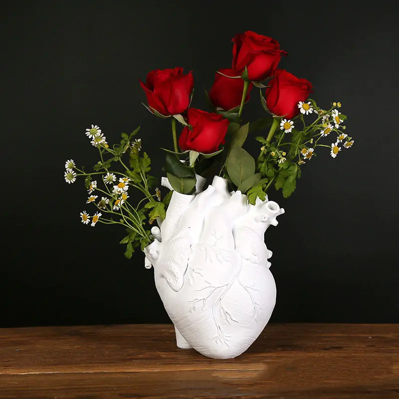 AmoorCity Heart-Shaped Table Vase. Ceramic vase in a heart shape. Perfect for adding a romantic touch to any tabletop arrangement.