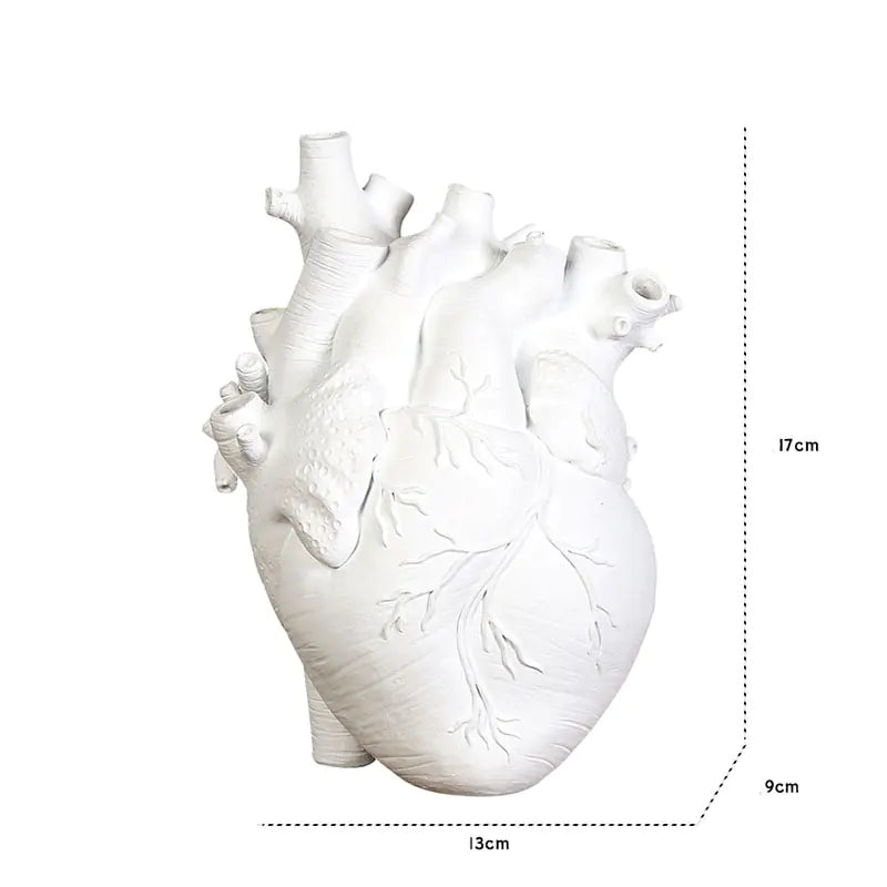 AmoorCity Heart-Shaped Table Vase. Ceramic vase in a heart shape. Perfect for adding a romantic touch to any tabletop arrangement.